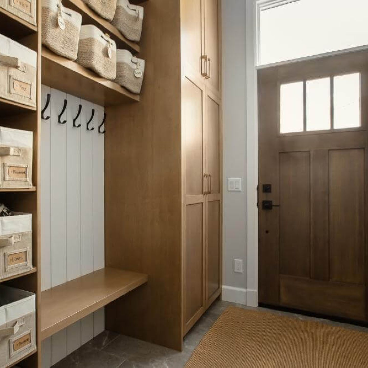 11 modern-entryway-mudroom-storage-with-wooden-door-and-organized-baskets