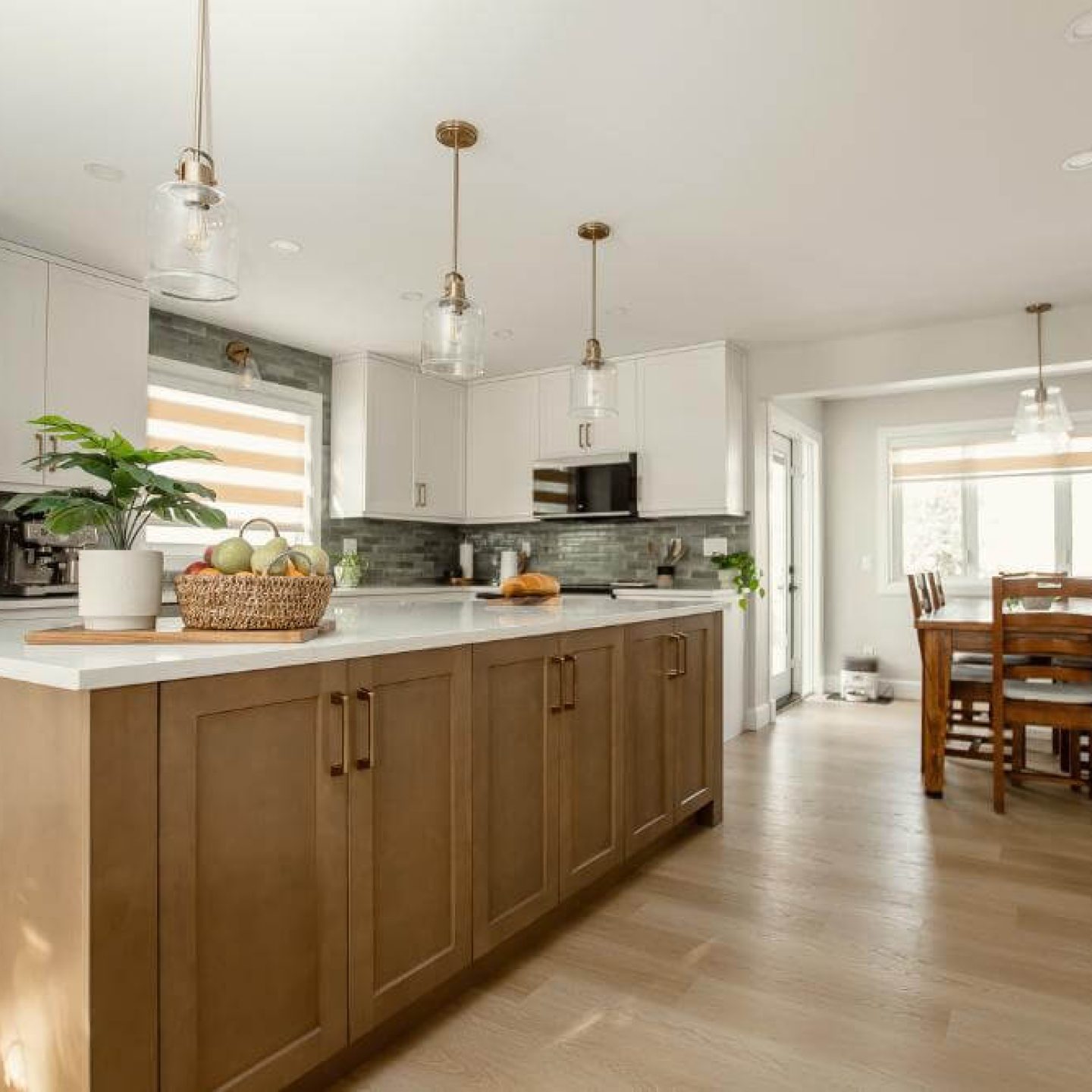 7 modern-white-kitchen-island-with-wood-dining-table-and-fruit-bowl
